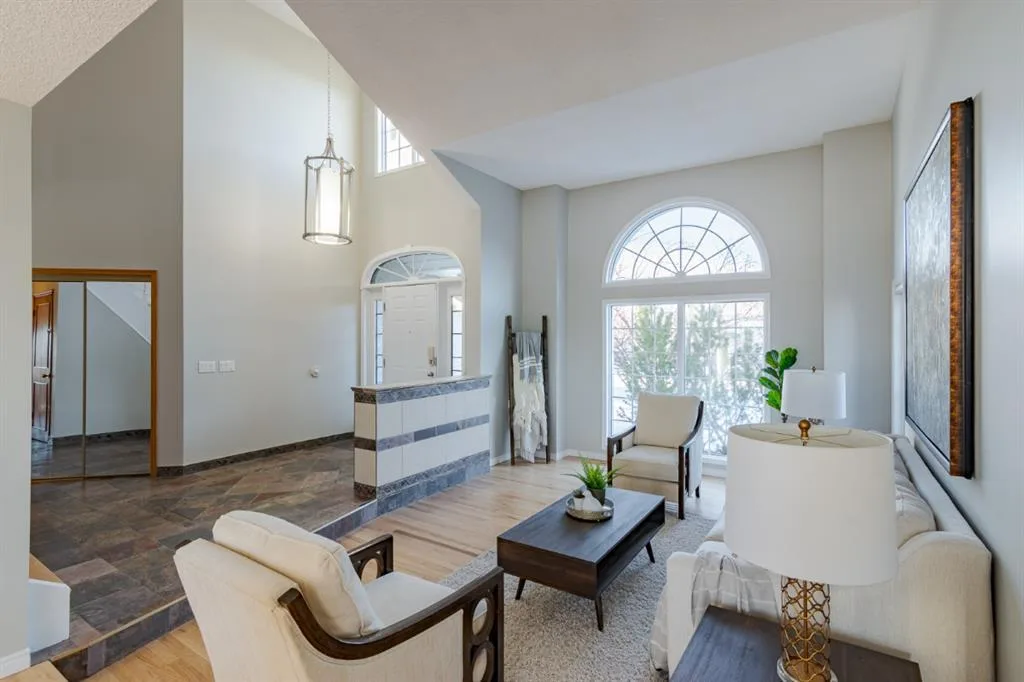 Completed Calgary living room with neutral walls and white trim